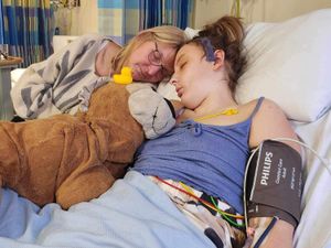 Joscelyne Kerr in hospital bed with her mother Ann