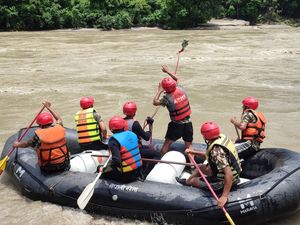 Supporting image for story: 11 bodies recovered after landslide sweeps two buses into river