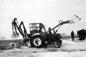 One of David's early diggers clearing snow off the A41 at Crosshills, Sambrook, in 1967.