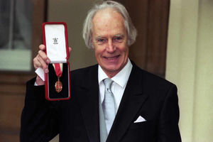 Sir George Martin with his knighthood at Buckingham Palace