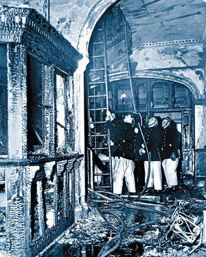 Firemen work in the main lobby of the hotel