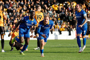 Taylor Perry celebrates his late equaliser at Cambridge (AMA)