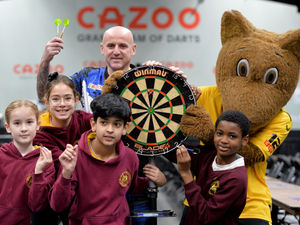 Supporting image for story: Children enjoy games as they learn more about maths through darts