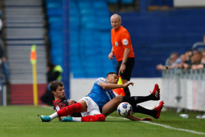 Tom Flanagan of Shrewsbury Town and Dane Scarlett of Portsmouth (AMA)