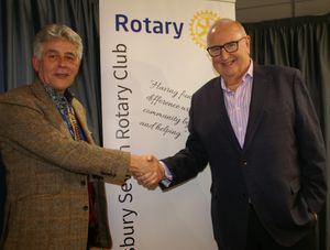 Caption: Shrewsbury Severn Rotary Club president Johnathan Callwood congratulates Ray Walker on his induction as a member.