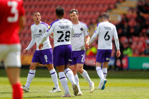 Shaun Whalley of Shrewsbury Town celebrates with his team mates after scoring a goal to make it 2-1 (AMA)