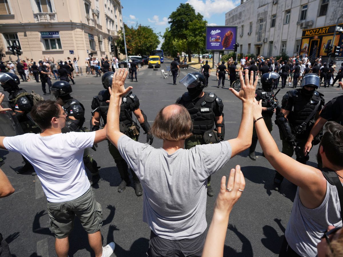 Serbian police remove barricades and make new arrests as protesters block roads