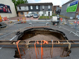 Supporting image for story: Work to repair a huge sinkhole could take six weeks