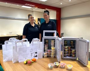Manor Farm Community Association handing out fruit and veg goodie bags in the Saddlers Centre.