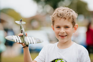 Ruben Scarlett 7 from Loggerheads watched as the 'THANK U NHS' Spitfire flew over PRH