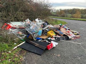 Shropshire Council said it was investigating after a large pile of rubbish - including food waste, cardboard and a shopping trolley - was dumped in a layby near Shifnal