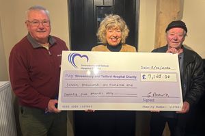 Viv Bradley, left, and Glyn Brown, right, with Julia Clarke, Director of Public Participation, proudly holding the £7,125 donation on behalf of everyone who took part.