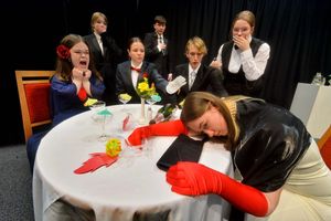 Ludlow College drama students in a scene from Yellow Iris: Poison victim: Pauline, played by Eleri Gittins 17, and sitting: Amelia Crane 17, Lara Starkey 17, Fred Lovegrove 16, back: Rebecca McNally 16, Ewan Godfrey 16, Klara Andow 16..