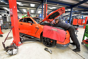A bright orange Nissan GTR getting the "650 conversion"