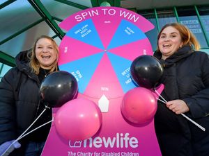 Karen Cox and Abbey Costello from Newlife charity, Cannock, with the Spin to Win game.