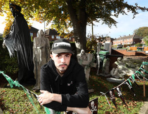 A graveyard will greet guests at the front of the home