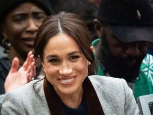 Meghan smiling as she watches the Invictus Games