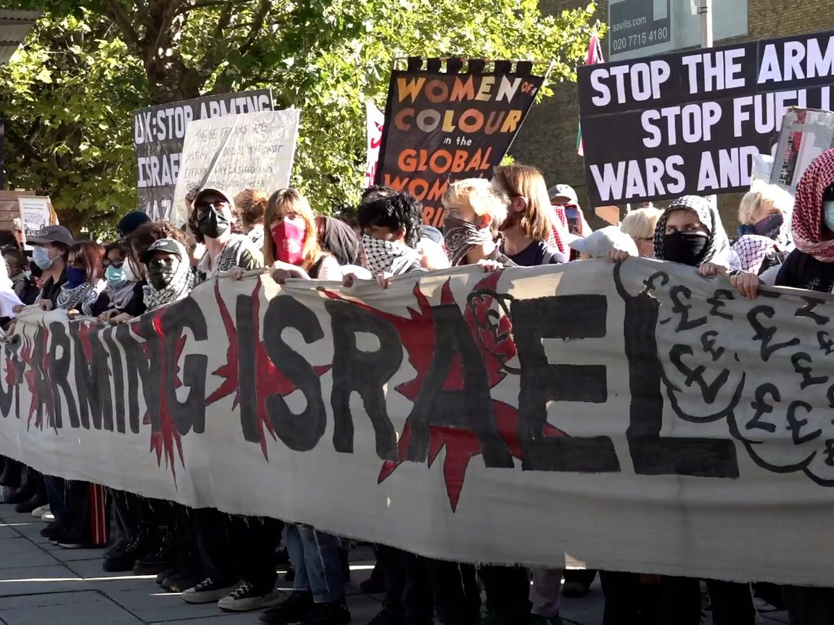 Three arrested after protest outside defence event