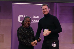 Councillor Chris Burden receives the Young Councillor of the Year award