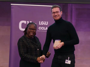 Councillor Chris Burden receives the Young Councillor of the Year award