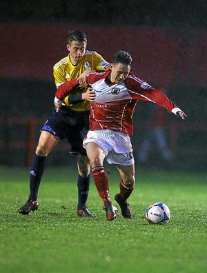 Neill Byrne of AFC Telford United and Scott Allison of Workington