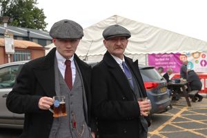 Costumed customers enjoy a beer at Bridgnorth Beer Festival 2024.