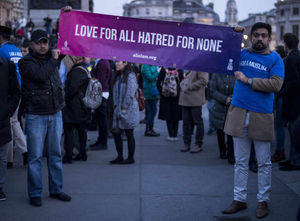 A message of unity is held up at the vigil