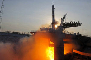 The Soyuz TMA-19M space ship blasts off on the rocket