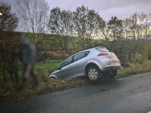 Supporting image for story: Car pulled from ditch by tractor after crash 