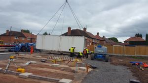 The house is lowered into place