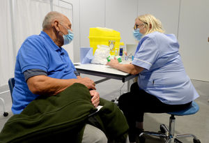 Terry Dudley, aged 78, receives his jab at Telford International Centre