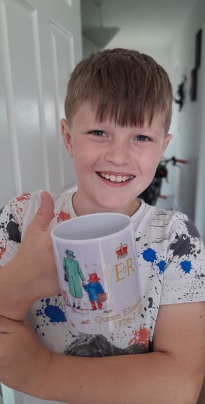 Max Edmonds got one of the commemorative mugs. Photo: Fay Poole