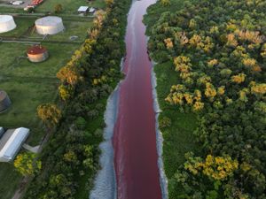 An aerial view of the waterway dyed red