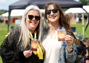 Friends Marisa Kenney and Sam Dartford enjoy the music and entertainment