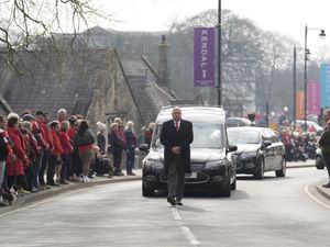 A hearse carrying the coffin of 10-year-old Poppy Atkinson makes its way to Kendal Parish Church ahead of her funeral service