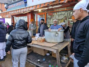 People queued along the route to get food, with sweet and savoury on offer