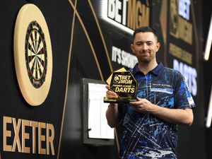 Luke Humphries celebrates with the trophy following night four of the Premier League in Exeter