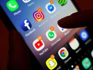 A mobile phone screen with apps