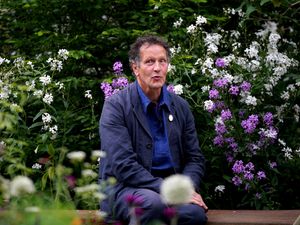 Monty Don surrounded by blooms at the Chelsea Flower Show