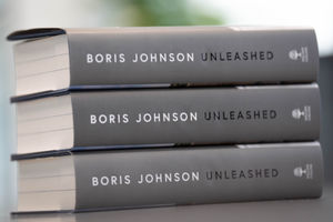 A pile of copies of former prime minister Boris Johnson's latest memoir, titled Unleashed