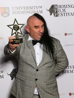 Nick J Townsend with the band's award for best music video at the Birmingham Film Festival