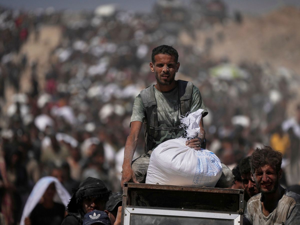 Eight people seeking food among at least 12 killed by Israeli fire in Gaza