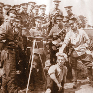 This picture relates to Captain Percy William Laverick, a soldier of the Great War, who was the maternal grandfather of David Bevan-Jones of Shrewsbury, who supplied the photo. It shows the then Lieutenant Laverick, holding an item and standing behind an easel. The caption indicates that it's an informal presentation (but not clear of what). David's grandfather, who was known as Billy, came from London. He was injured in 1917 and won the Military Cross in 1918
