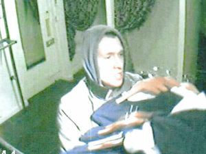 Supporting image for story: Detectives in hunt for 'smiling' robber