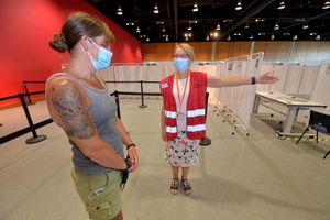 Volunteer Pam McPhillips guides Abby Winchester from RAF Cosford at the International Centre, Telford