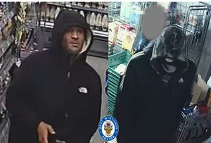 Two men police want to speak with after a robbery at a shop in Smethwick
