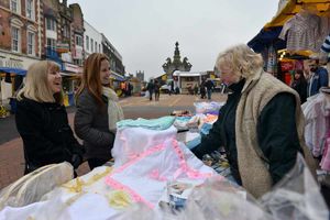 Shoppers browse market stalls in Dudley's High Street