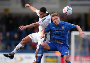 Russell Benjamin of AFC Telford United and Chris Churchman of Stockport County