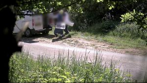Video grab of a couple flytipping on a rural road near Royal Wootton Bassett, Wiltshire. Video shows the moment a couple was caught flytipping piles of cardboard and rotten food waste on a country road - before being fined £3,000. CCTV cameras set up on a rural road near Royal Wootton Bassett, Wiltshire, captured the couple fly-tipping on two separate occasions.The couple arrived on a white van and dumped piles of cardboard, plastic and rotten food - all of which came from a commercial business. Officers were able to trace the couple after their vehicle and registration was also captured in the footage.