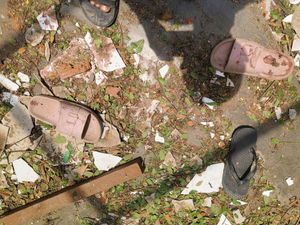 Footwear scattered with debris in the school